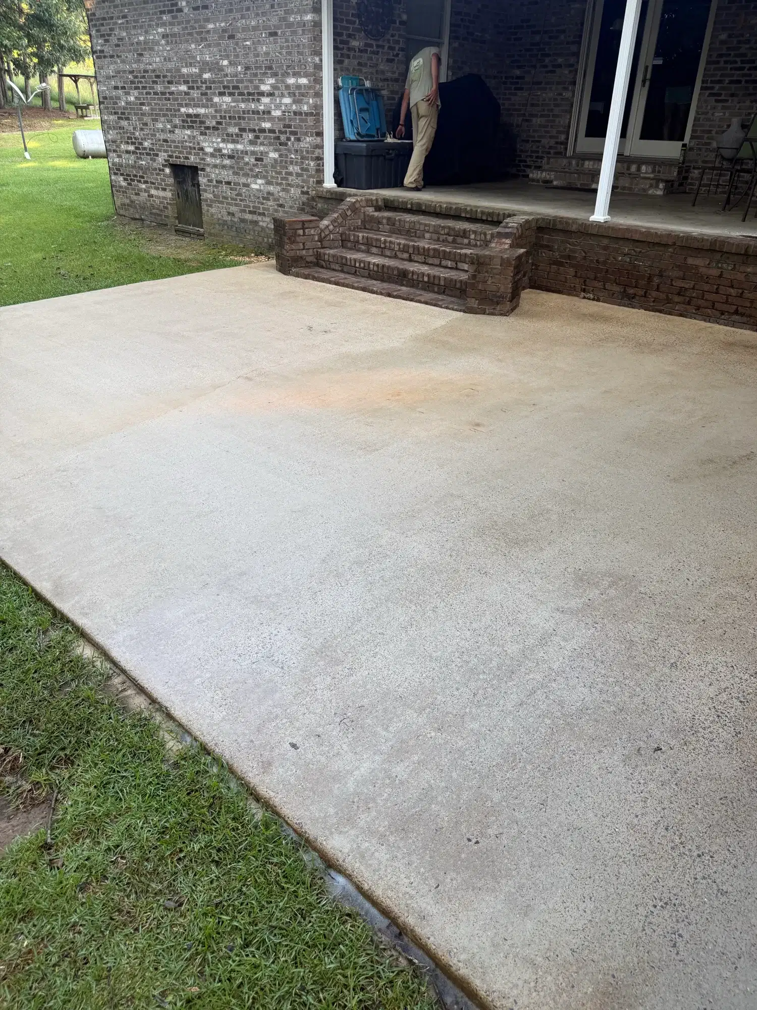 Clean concrete patio after pressure washing in Tuscaloosa Alabama