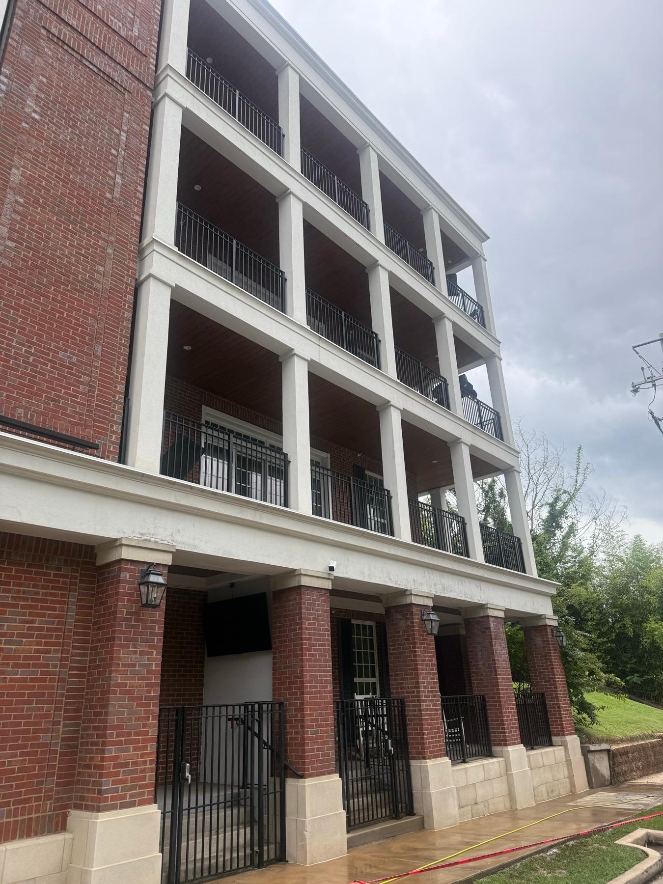 Clean multi story building exterior after professional maintenance
