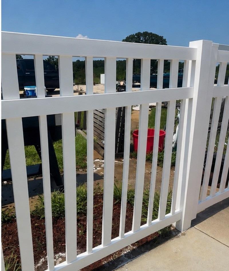 Bright white vinyl fence after pressure washing