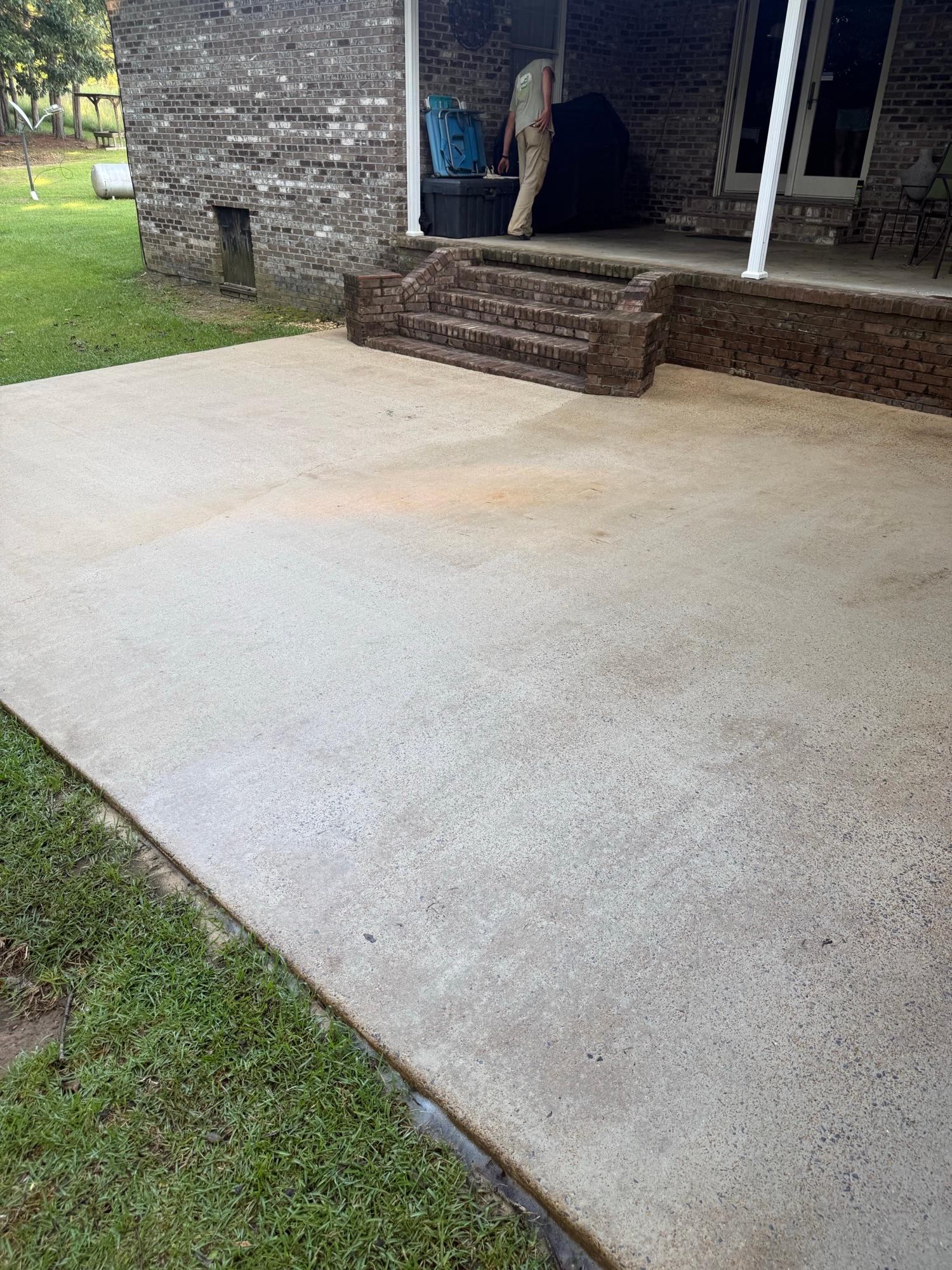 Clean concrete patio after professional pressure washing in West Alabama